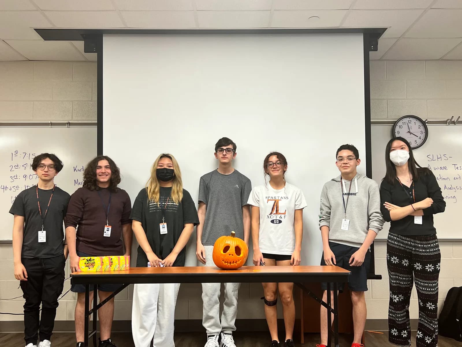 Fall social pumpkin-carving team lined up for a photo