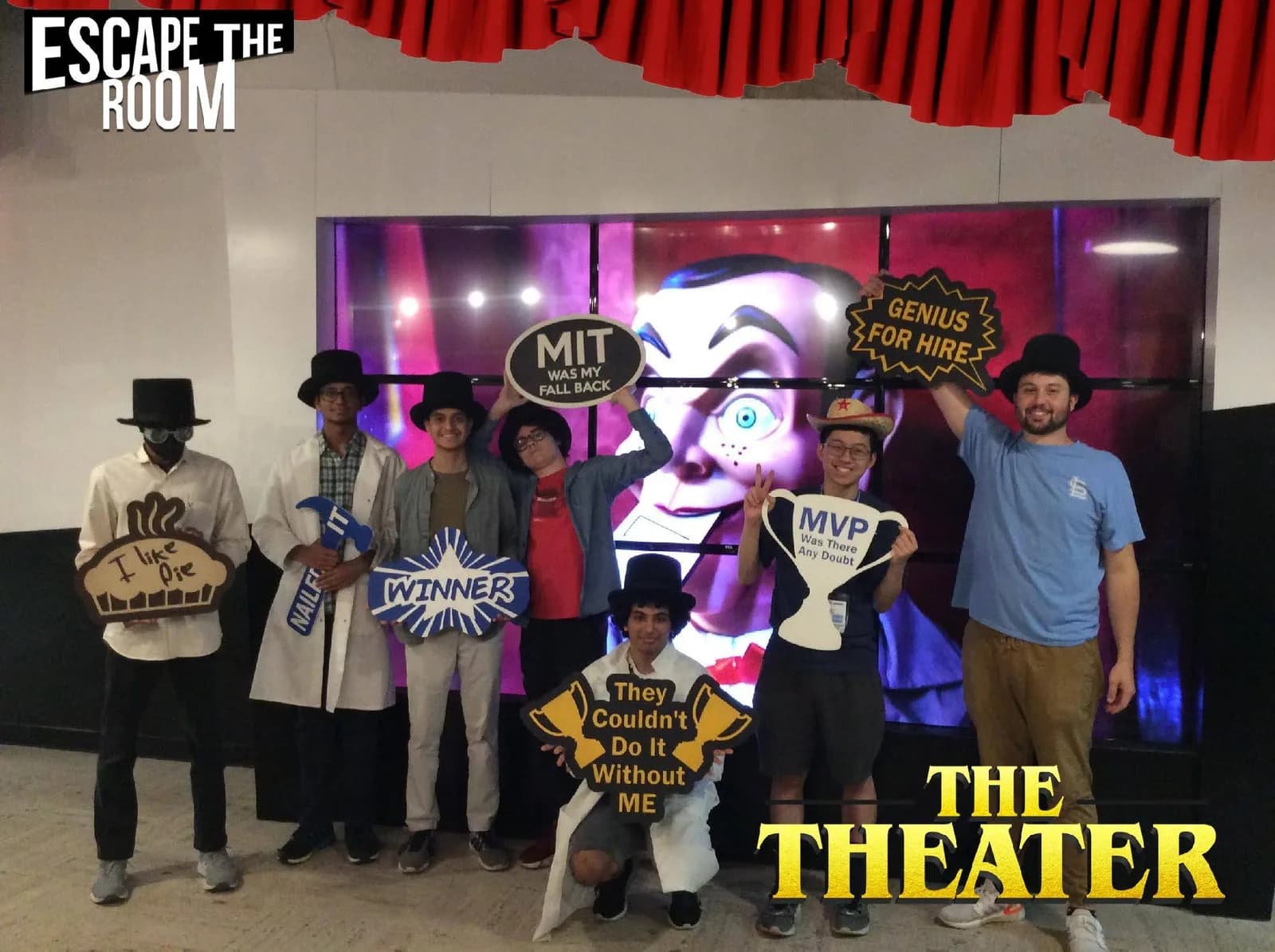 Group photo with props after beating the Escape The Room theater