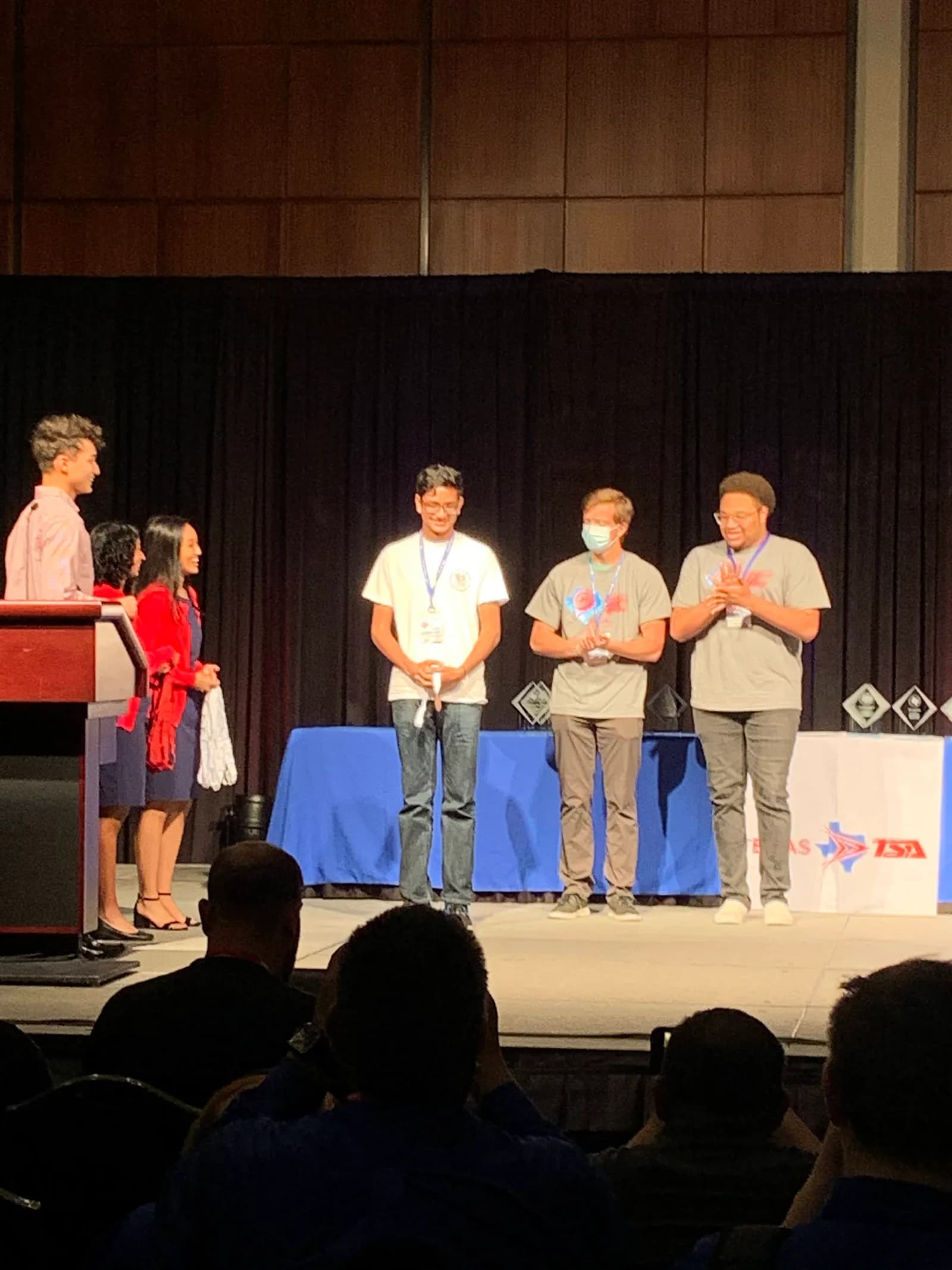 Members receiving plaques on the State awards stage
