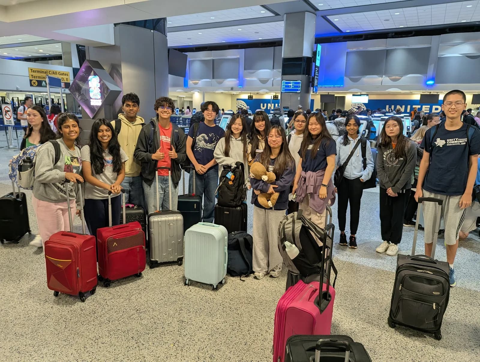 SLHS TSA members with their luggage at the airport check-in, ready to fly to the 2026 National TSA Conference