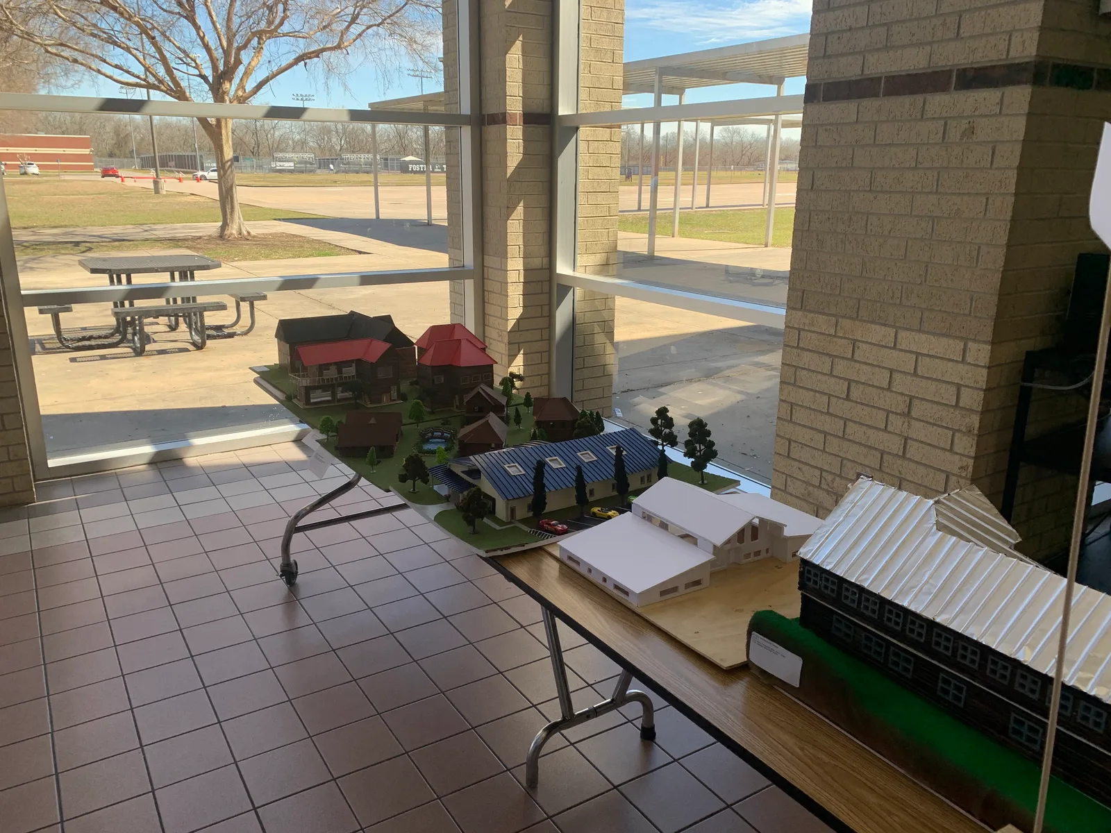 Architecture model homes lined up on display tables