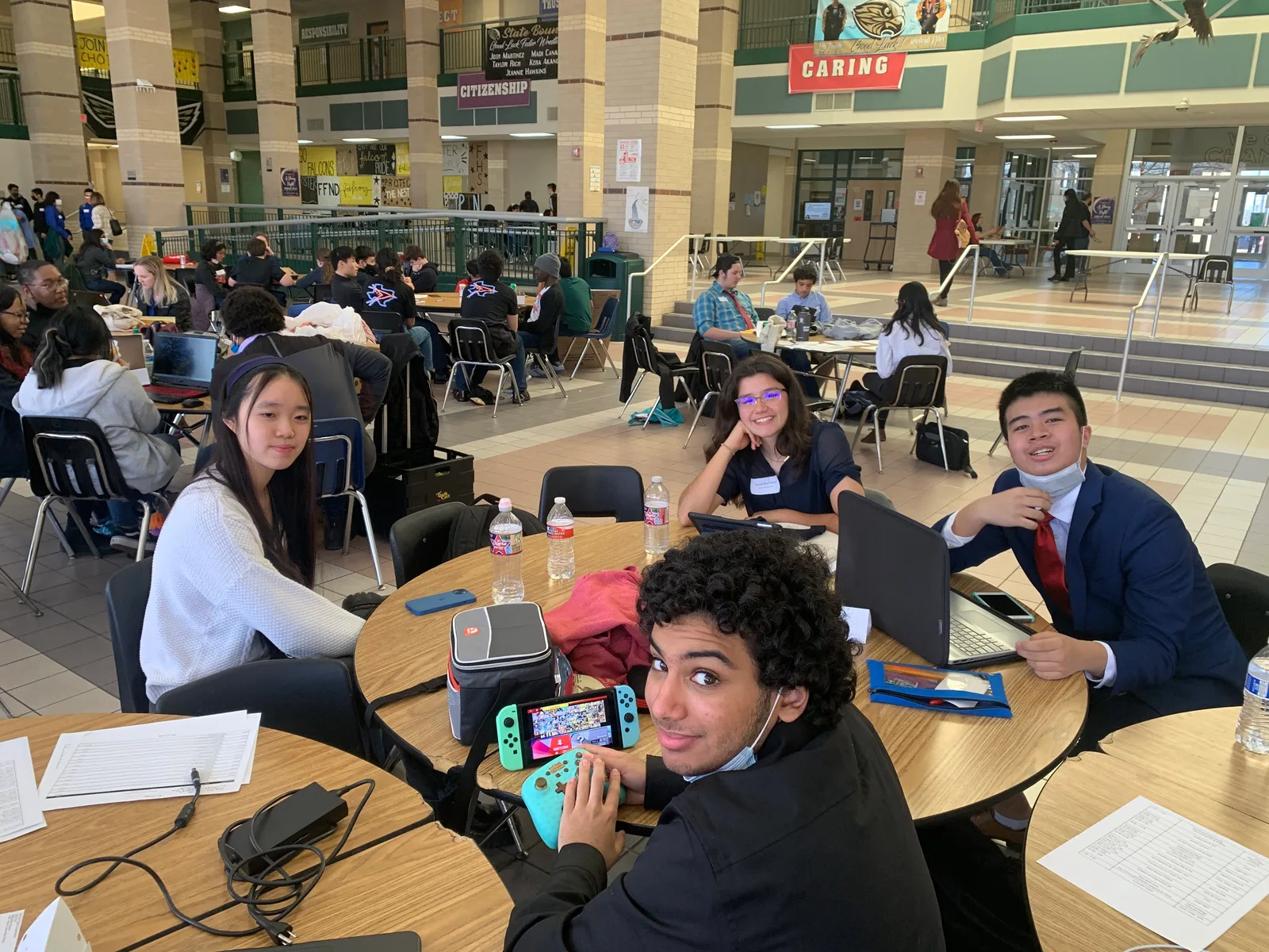 Members hanging out at a round table between events