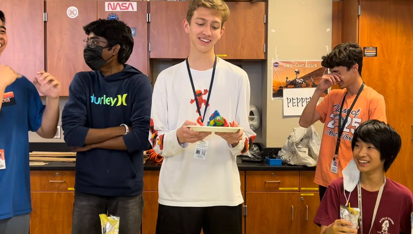 Member presenting a colorful creation at the fall social