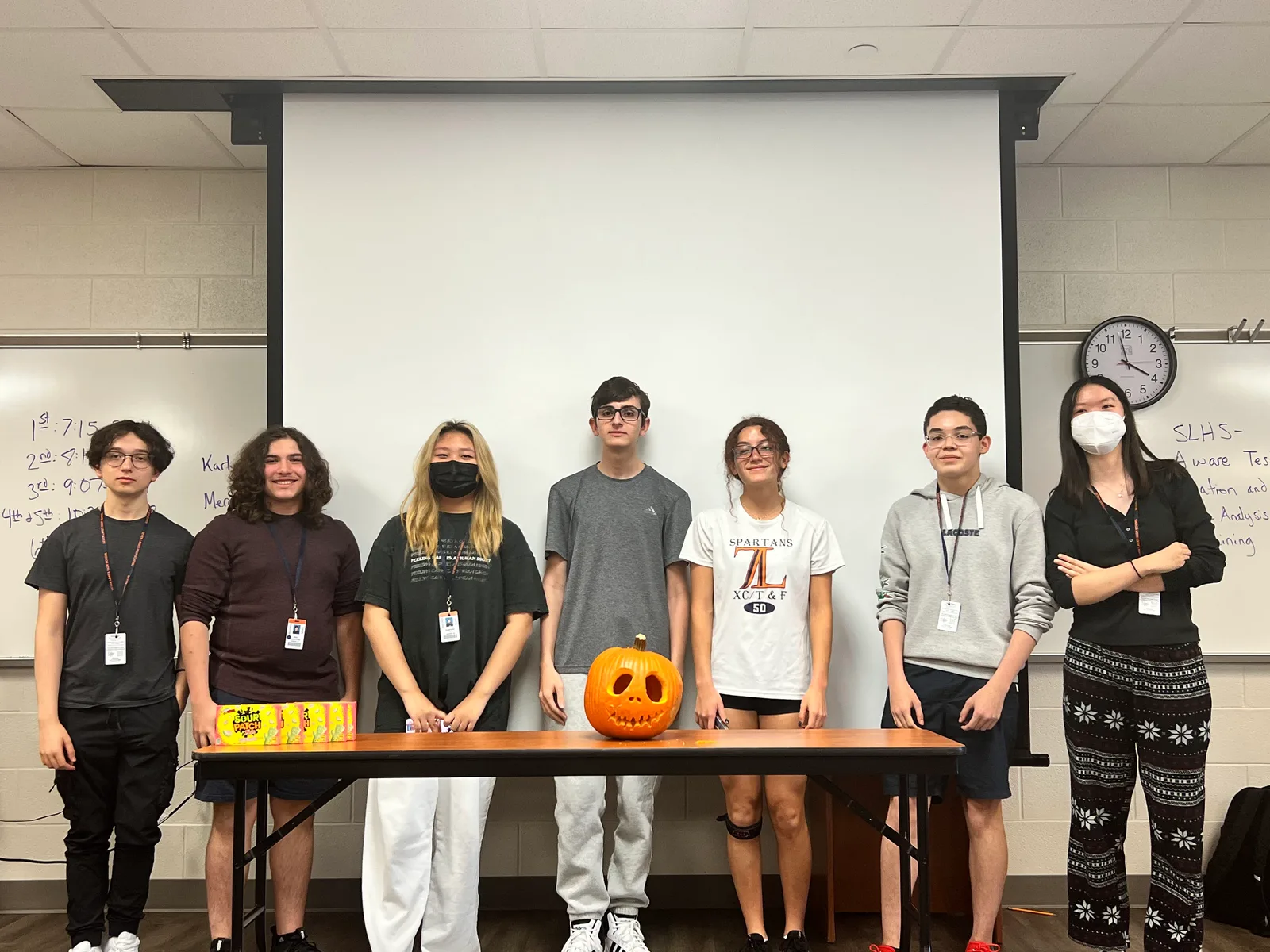 Fall social pumpkin-carving team lined up for a photo