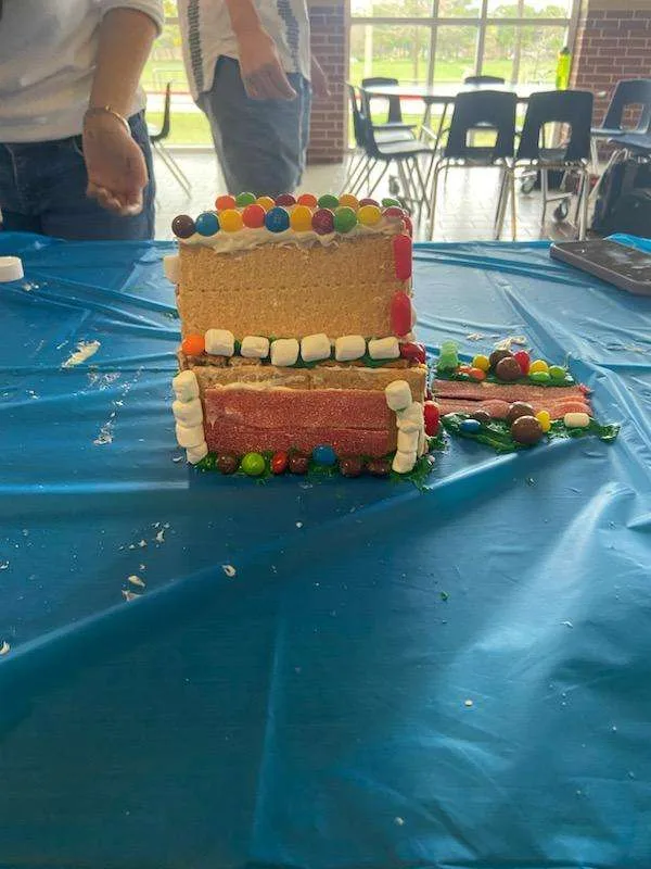 Layered candy-and-cracker build on the blue tablecloth