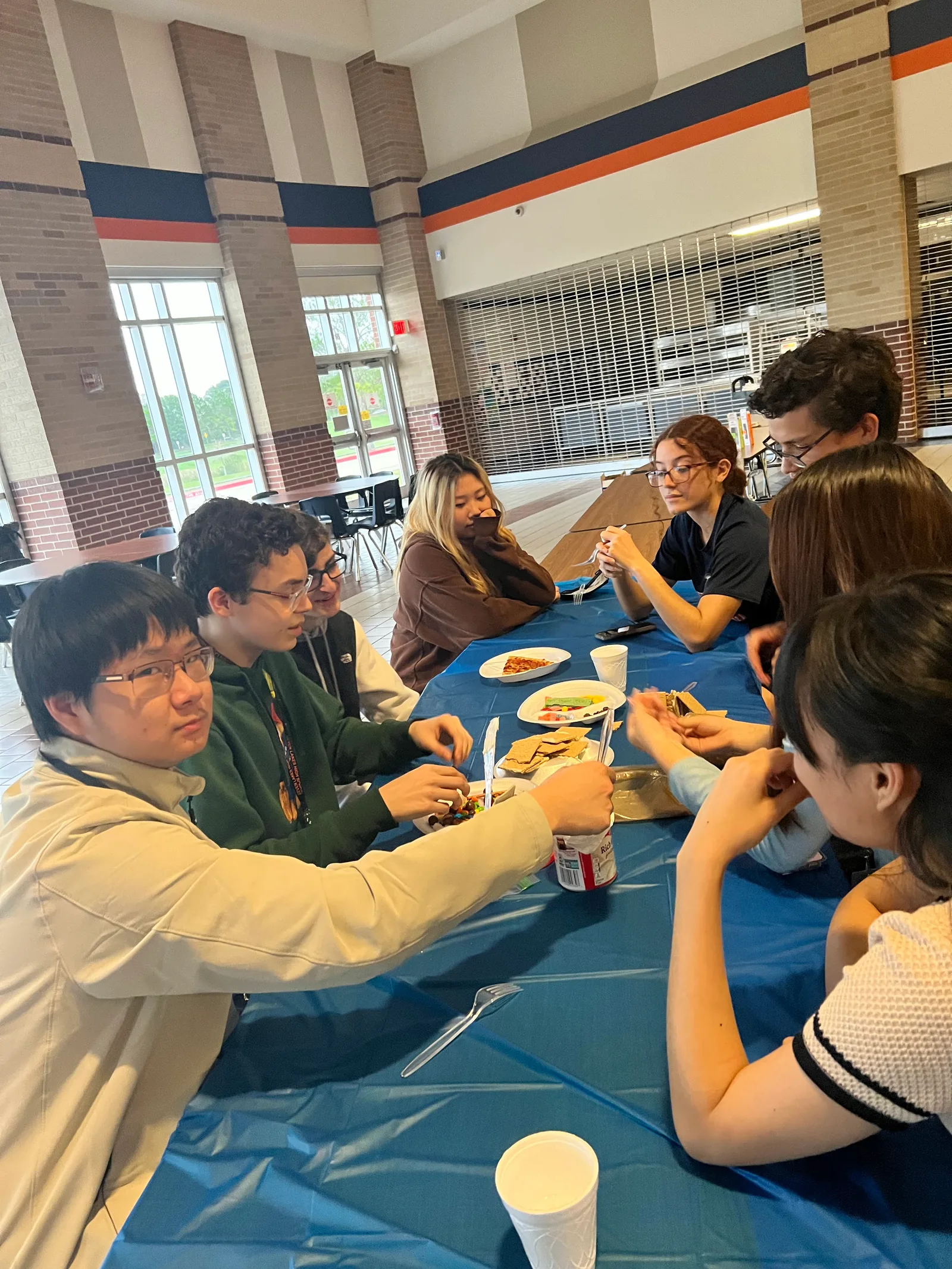 Members hanging out around the winter social table