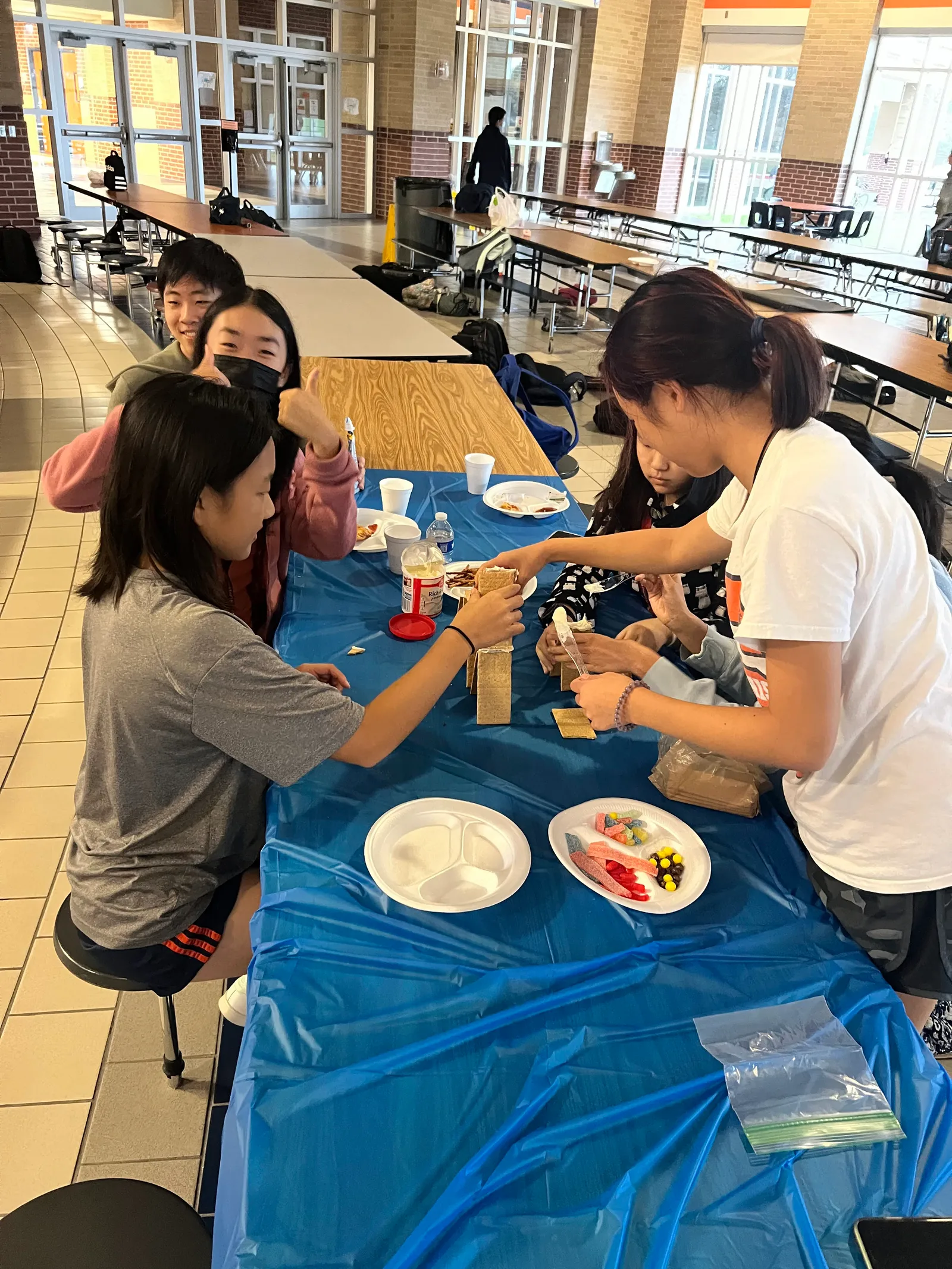 Members working on builds together at the table