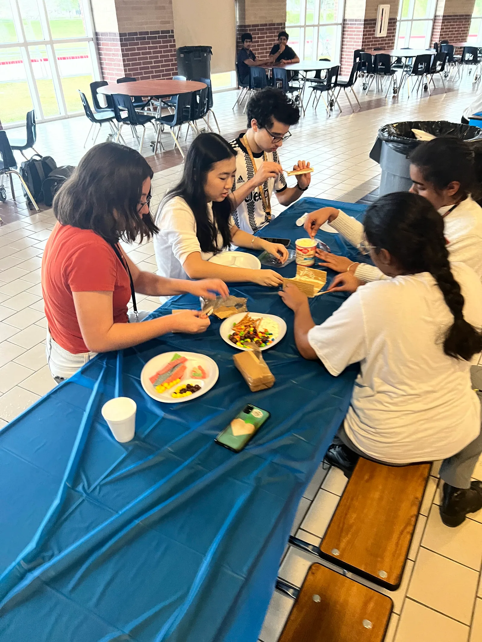 Members decorating builds in the cafeteria