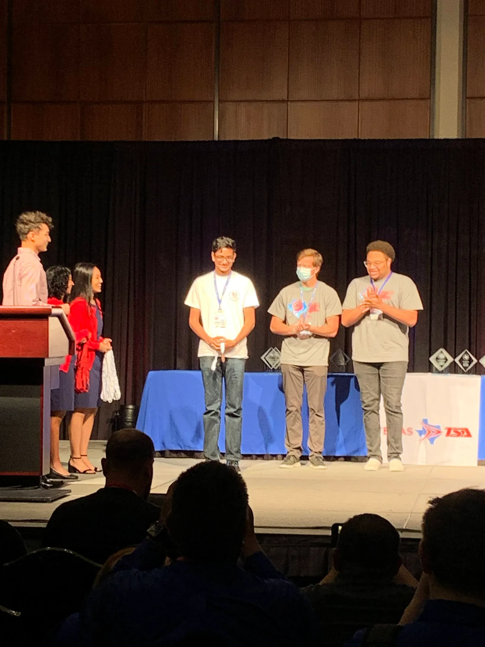 Members receiving plaques on the State awards stage