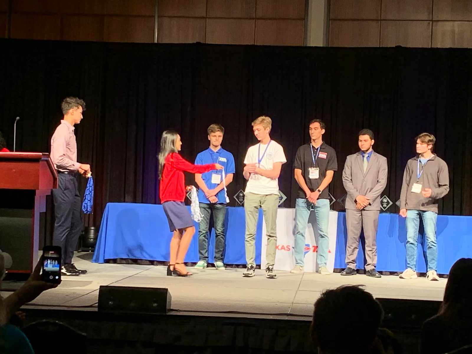 Competitors recognized on stage at the State conference