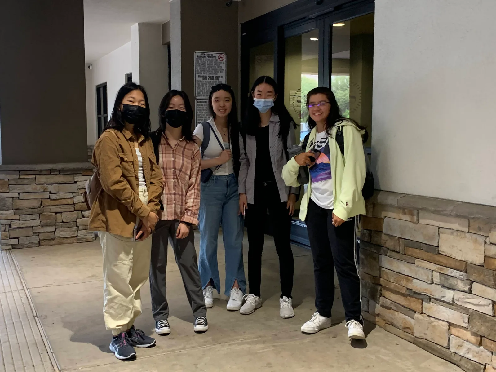 Members outside the hotel entrance before heading out