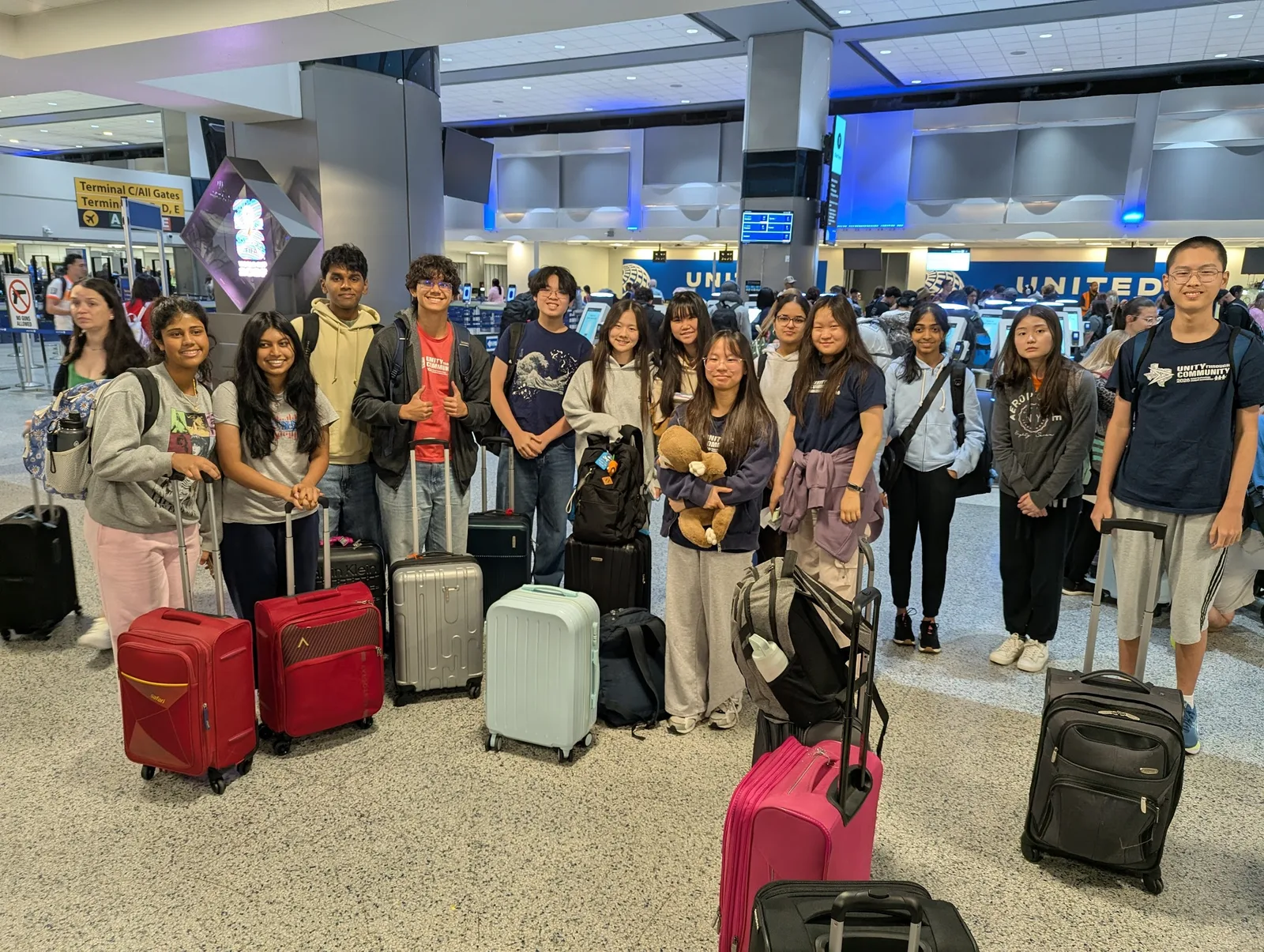 SLHS TSA members with their luggage at the airport check-in, ready to fly to the 2026 National TSA Conference