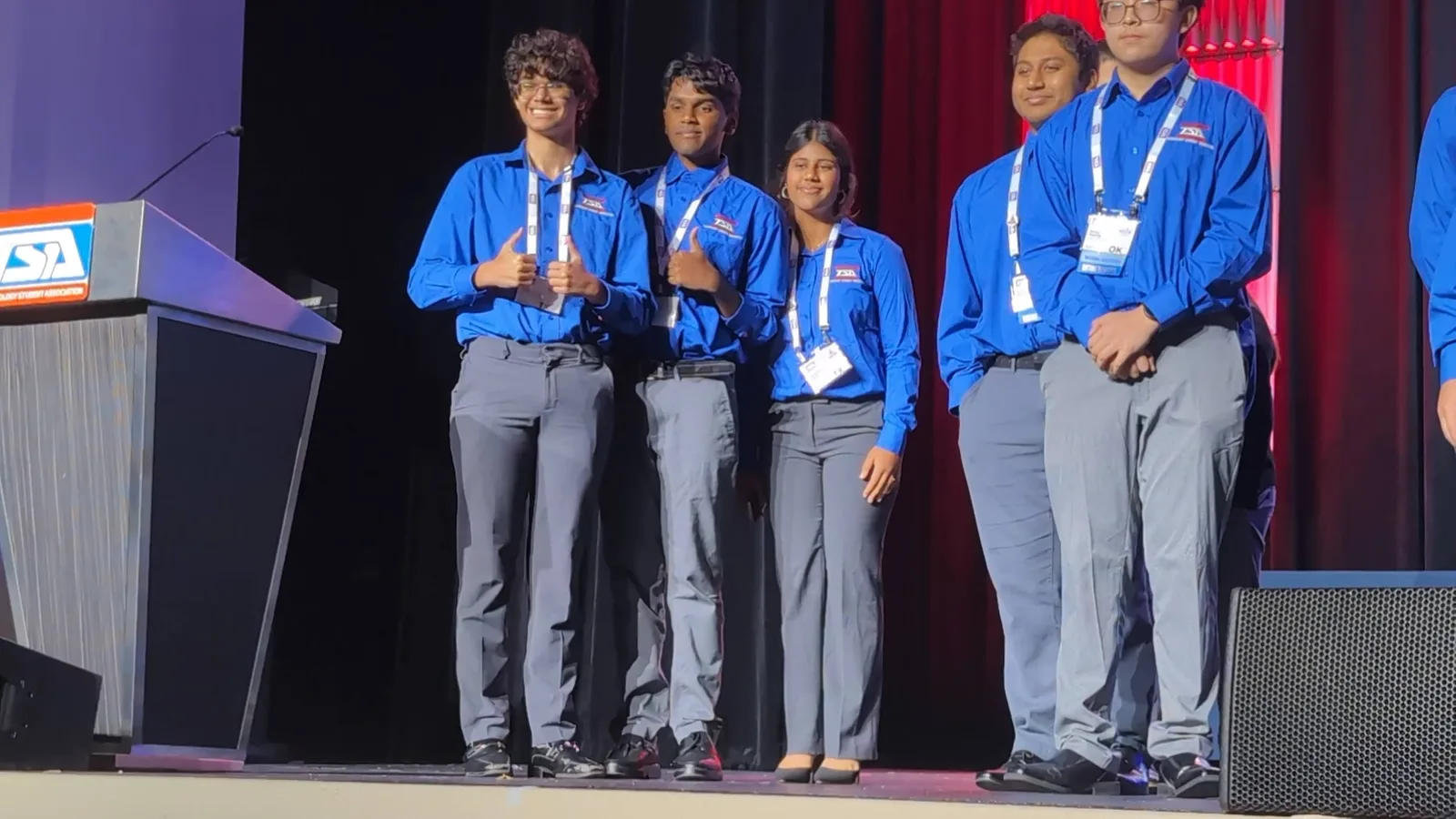 SLHS finalists give thumbs-up on the awards stage at the National TSA Conference
