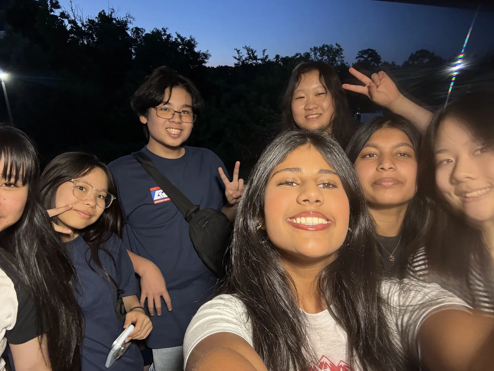 SLHS TSA members leaning in for a group selfie outdoors at dusk at the 2026 National TSA Conference
