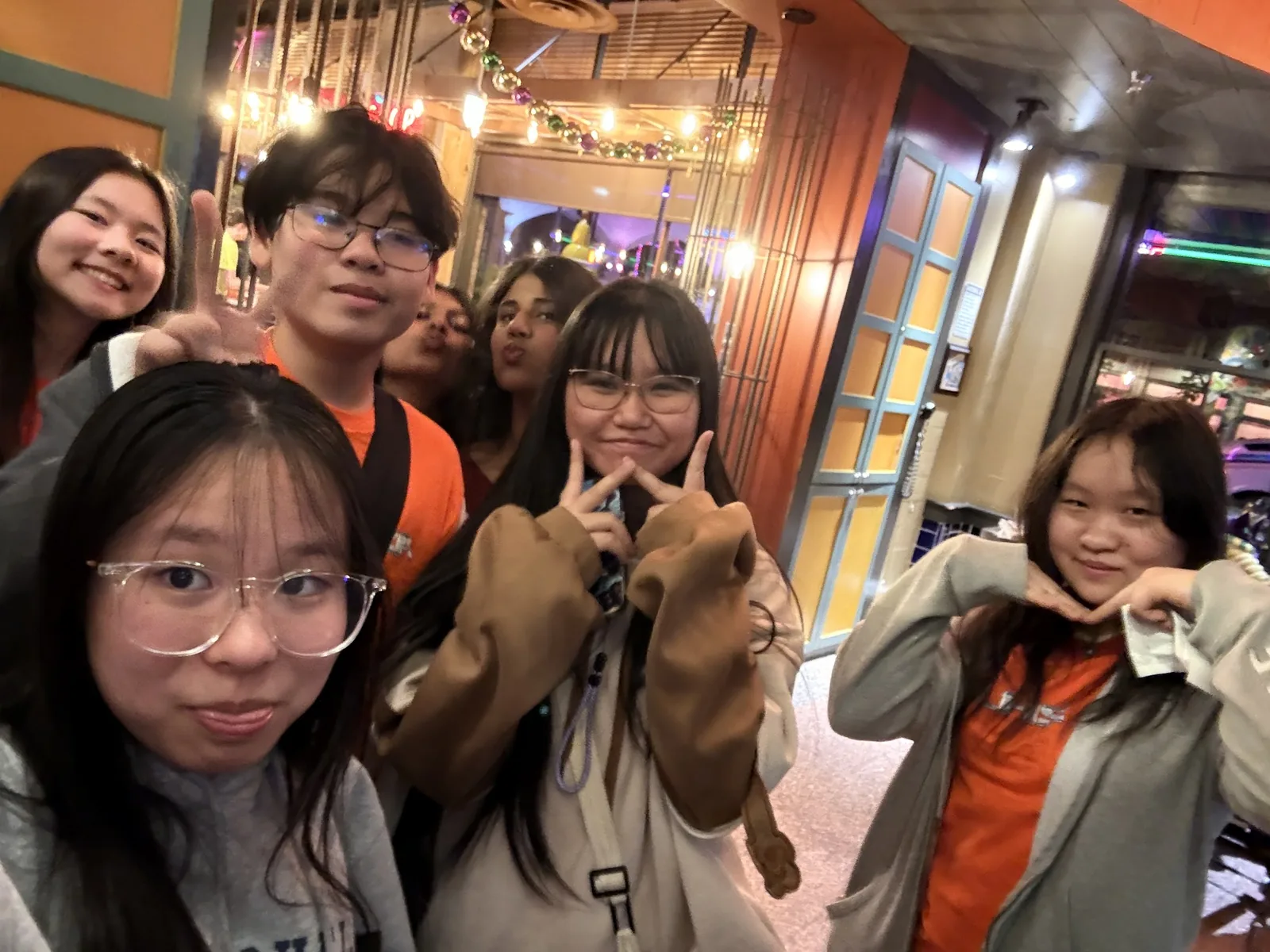 SLHS TSA members flashing peace signs on a night out during the 2026 Texas TSA State Conference