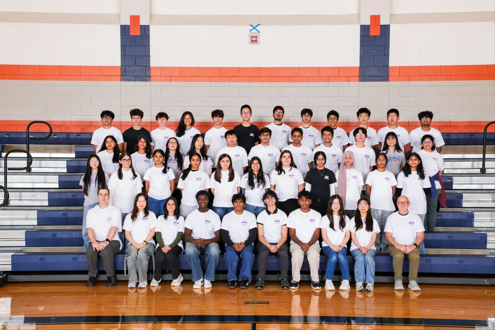 The full SLHS TSA chapter posing on the gym bleachers
