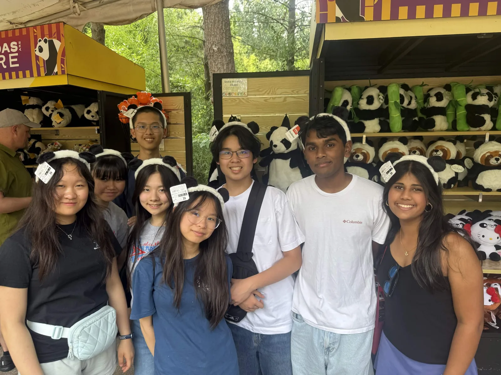 Members wearing panda headbands at the zoo gift shop on the chapter zoo trip